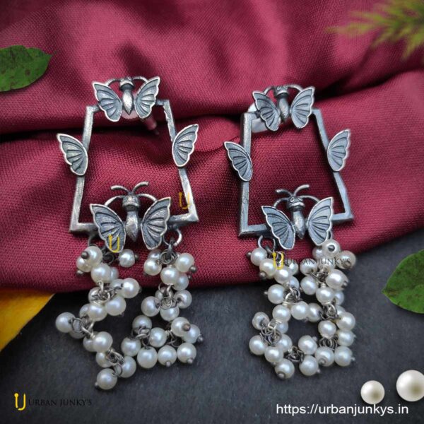 Silver lookalike butterfly pearl earrings