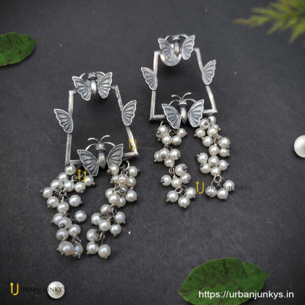 Silver lookalike butterfly pearl earrings